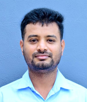 Dr. Anand S, another post doctoral researcher, depicted in a professional portrait against a plain backdrop