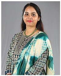 Aditi Dutta, a member of the faculty, depicted in a professional portrait.