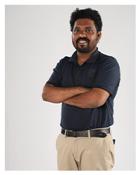 Mr. Hariprasad, a member of the faculty, captured in a professional portrait.