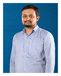 Sachin Jayaprakash, a faculty member, captured in a professional photograph.