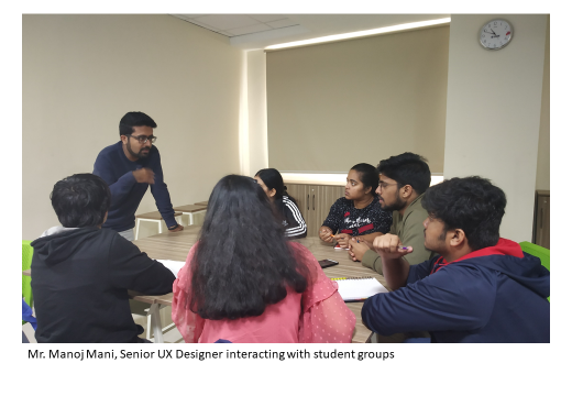 Workshop facilitators and participants engaging in group discussions or brainstorming sessions